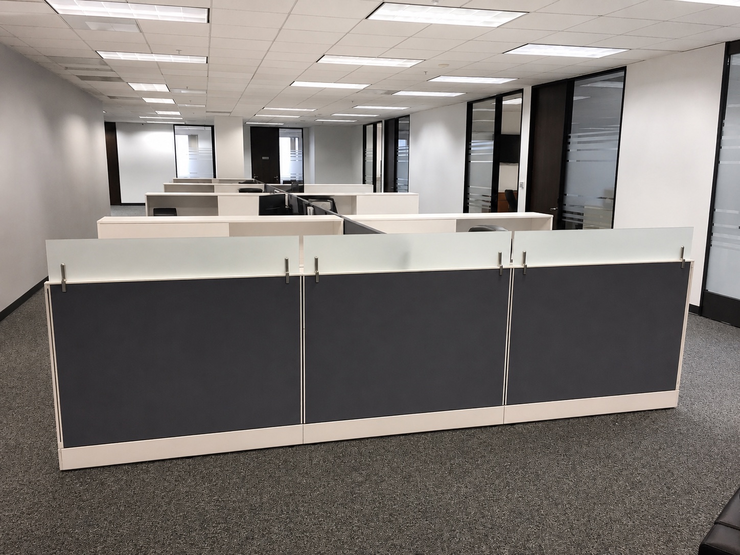Wide view of Presbia workstations and offices