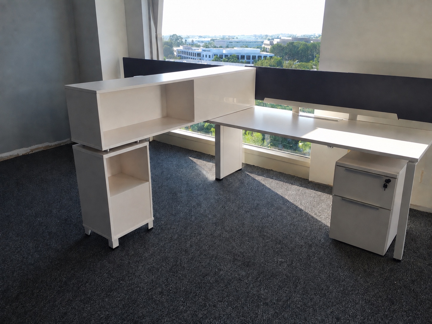 Completed Presbia open workplace with low workstation screens and glass-front offices
