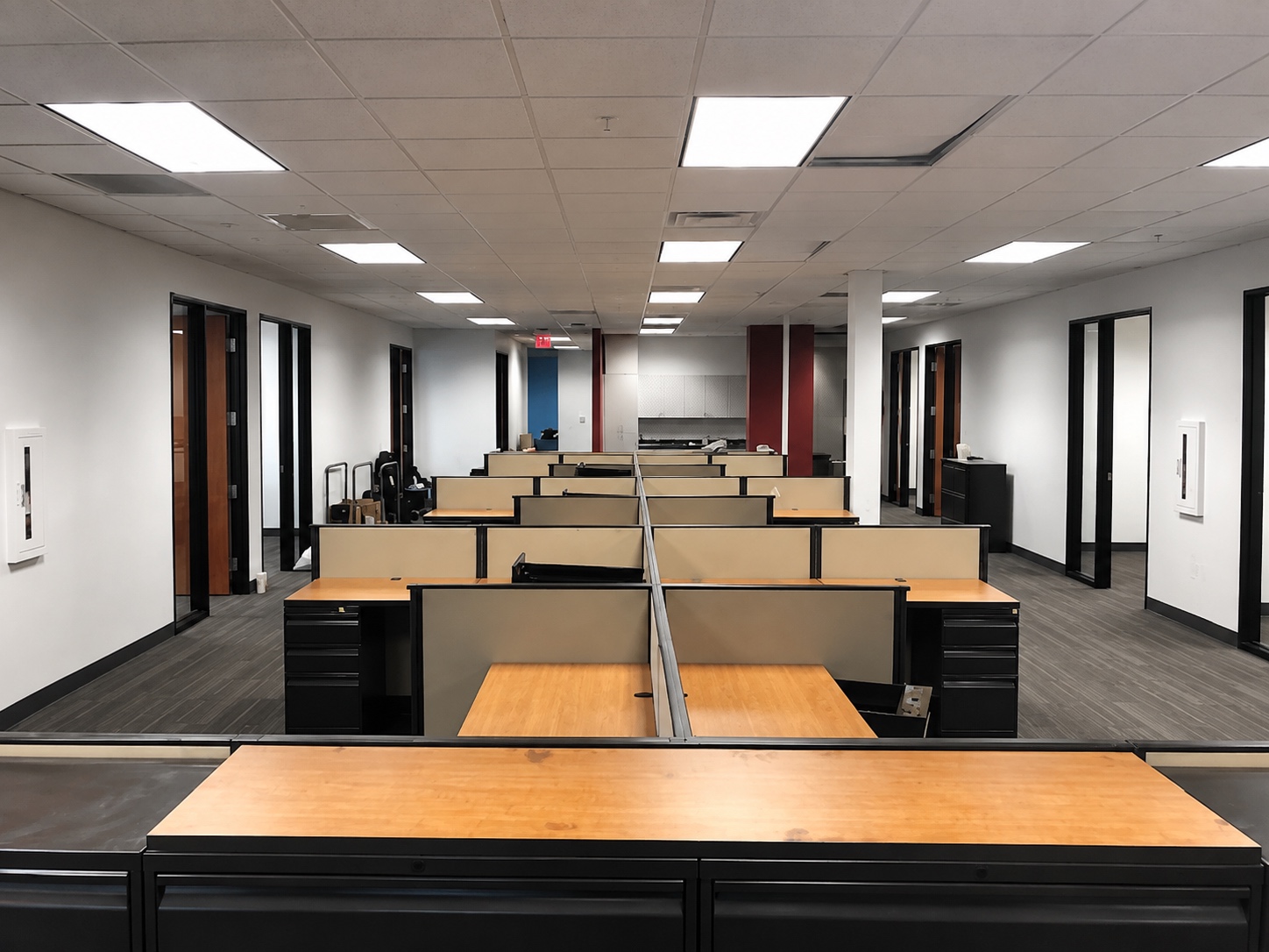 First American Title Las Vegas workplace with workstation rows and enclosed offices