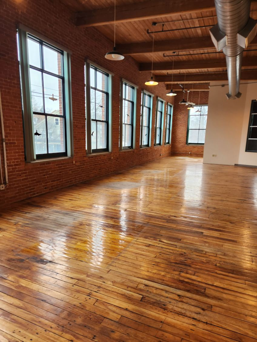 Cleared brick-and-wood office area following assigned decommissioning work in Northampton