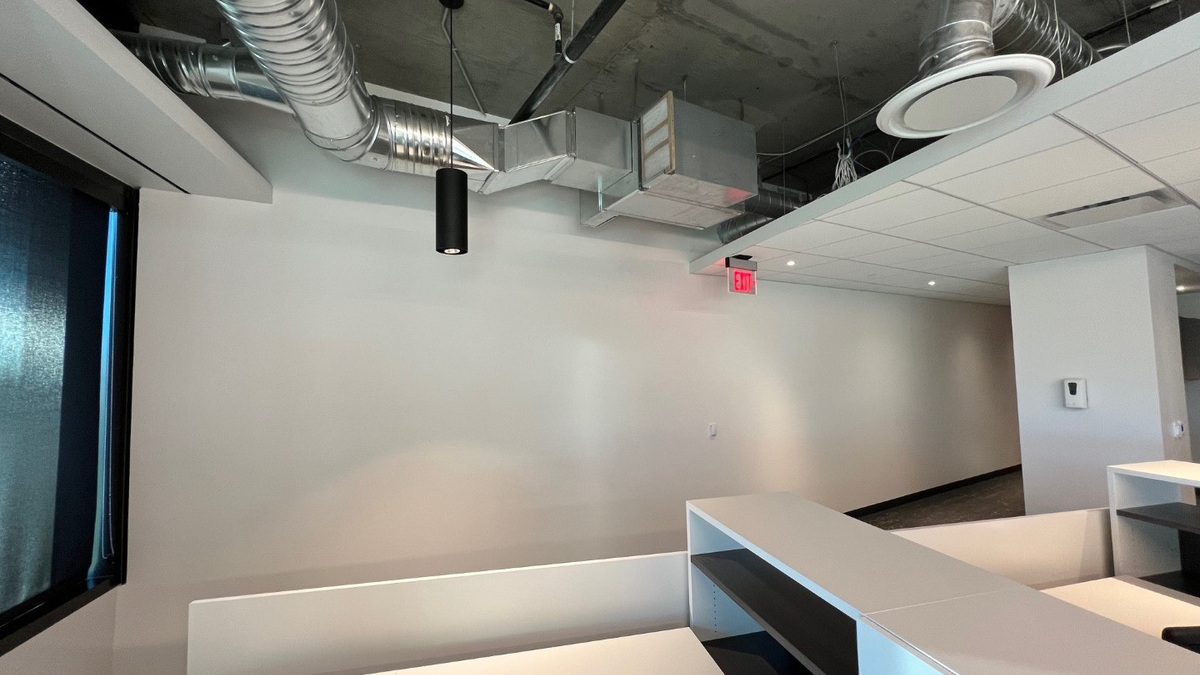 Reconfigured Stantec Chandler workplace with coordinated wall, ceiling and mechanical elements